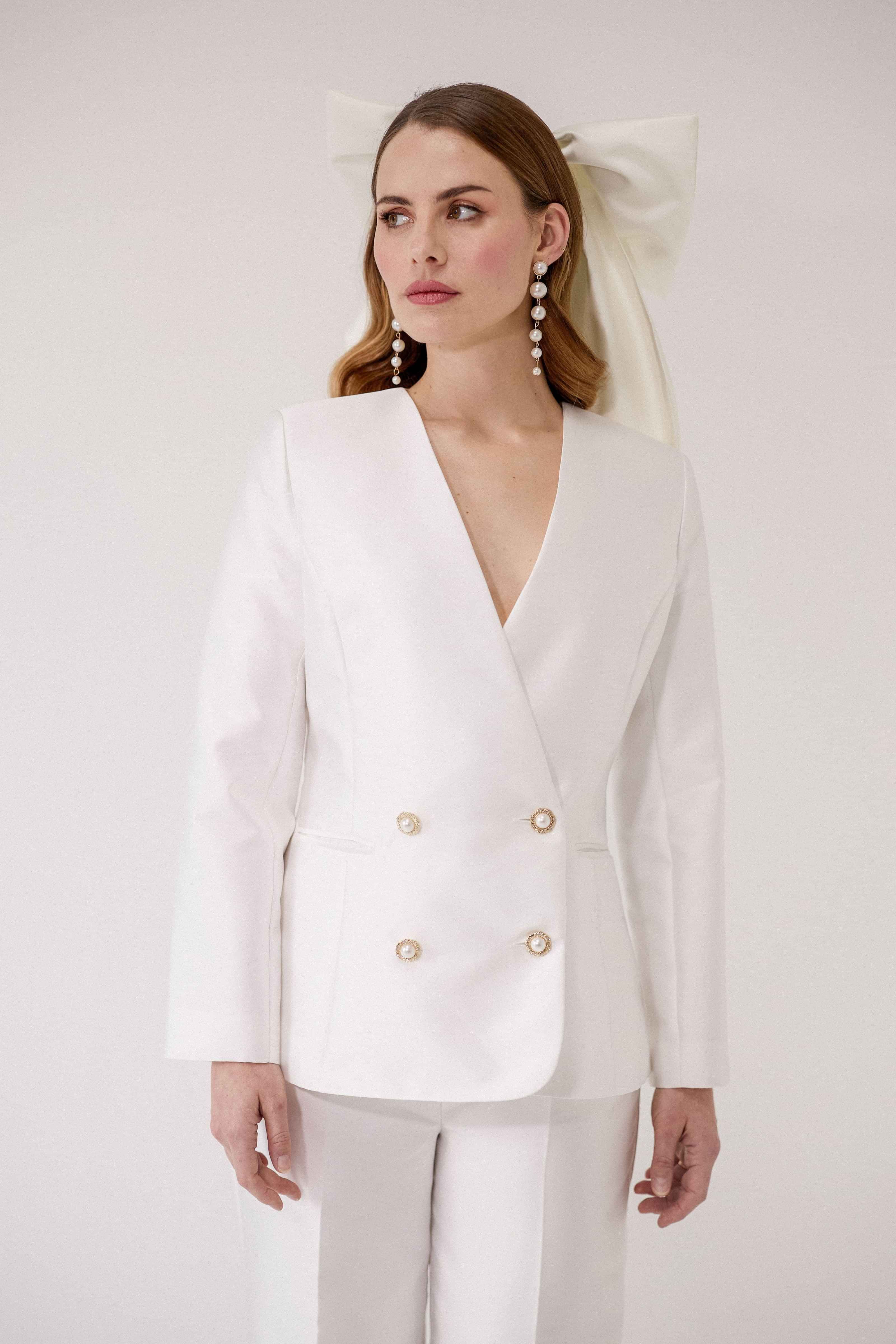 Close up of double breasted tailored bridal jacket in Silk Mikado, showcasing couture tailoring details, handcrafted in West London Acton