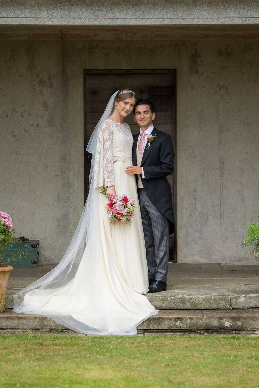 Bride wearing custom made wedding dress at her wedding at Hole Park Gardens, London bridal couture,