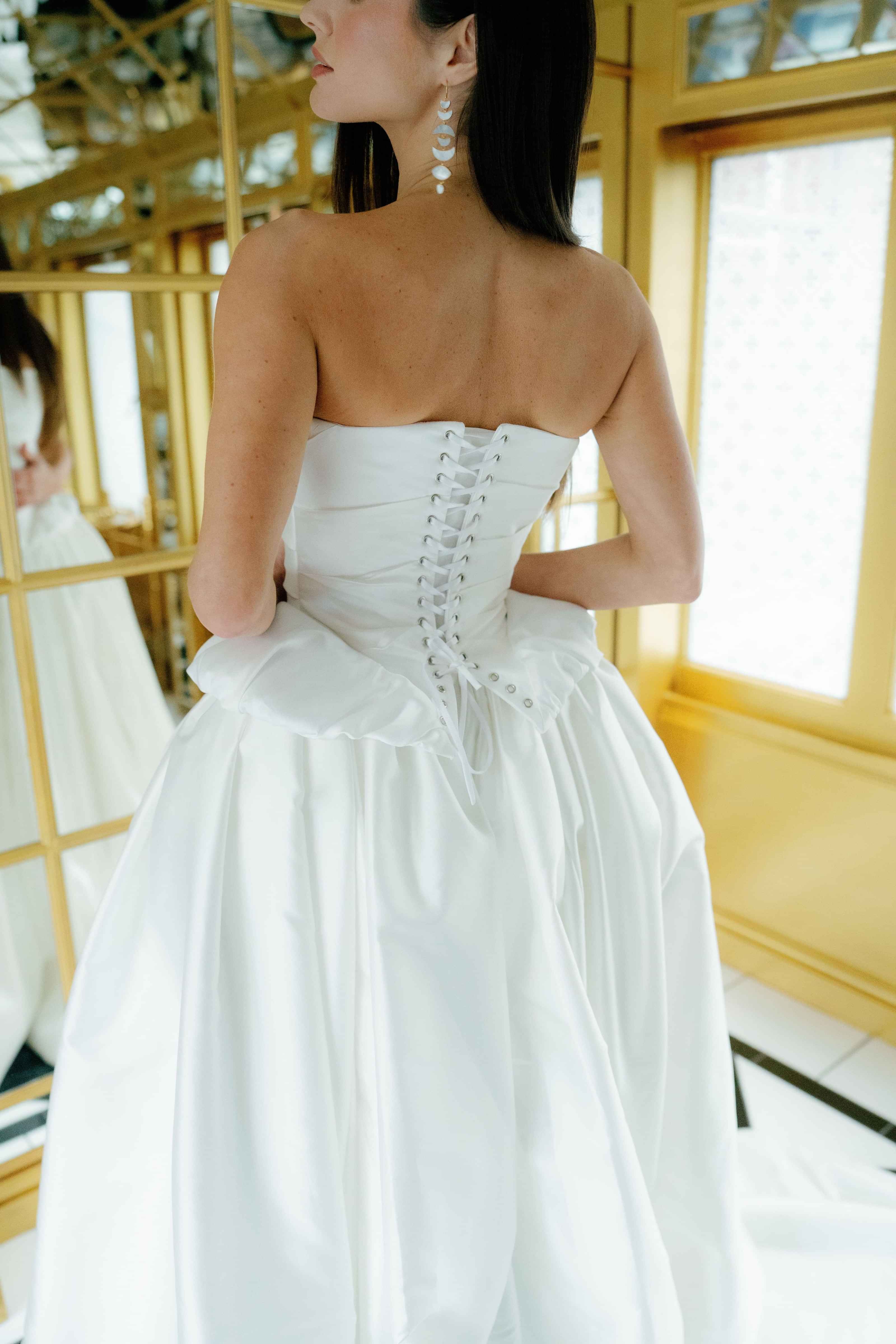 Close up back profile of corset detail on bridal gown by Kate Edmondson