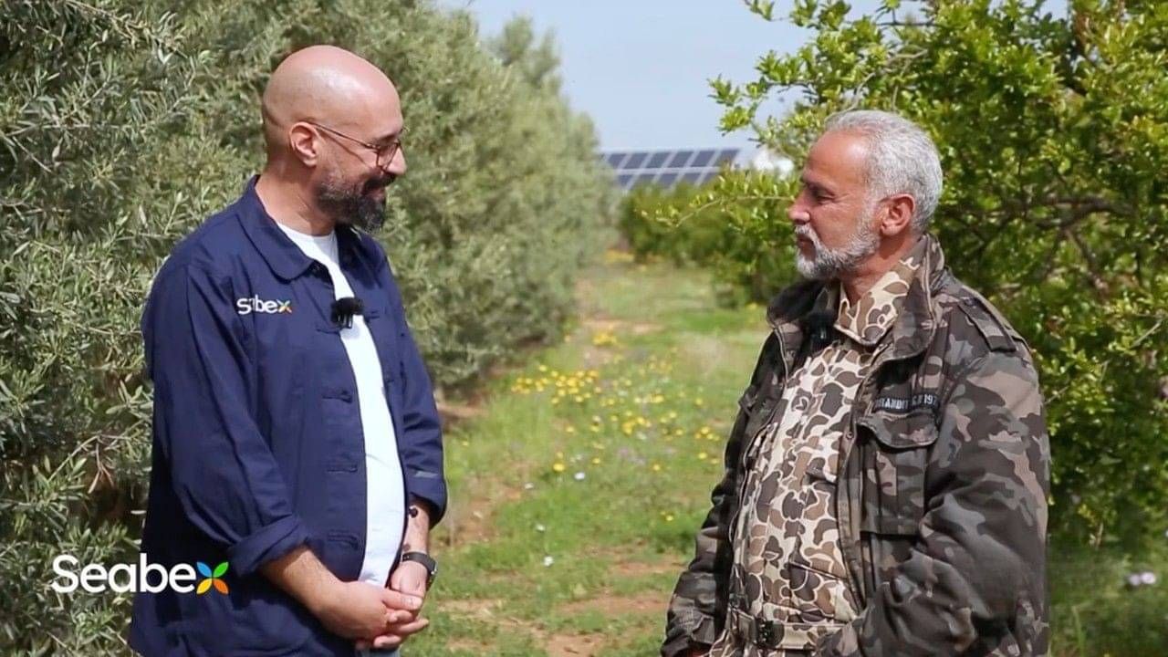 A Seabex agronomist with a farmer in an olive grove in Tunisia.