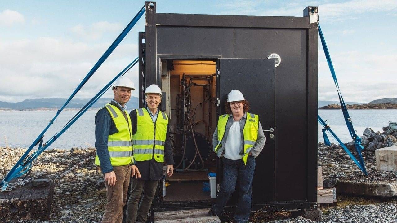The Flocean team outside a subsea desalination module on the Norwegian coast.