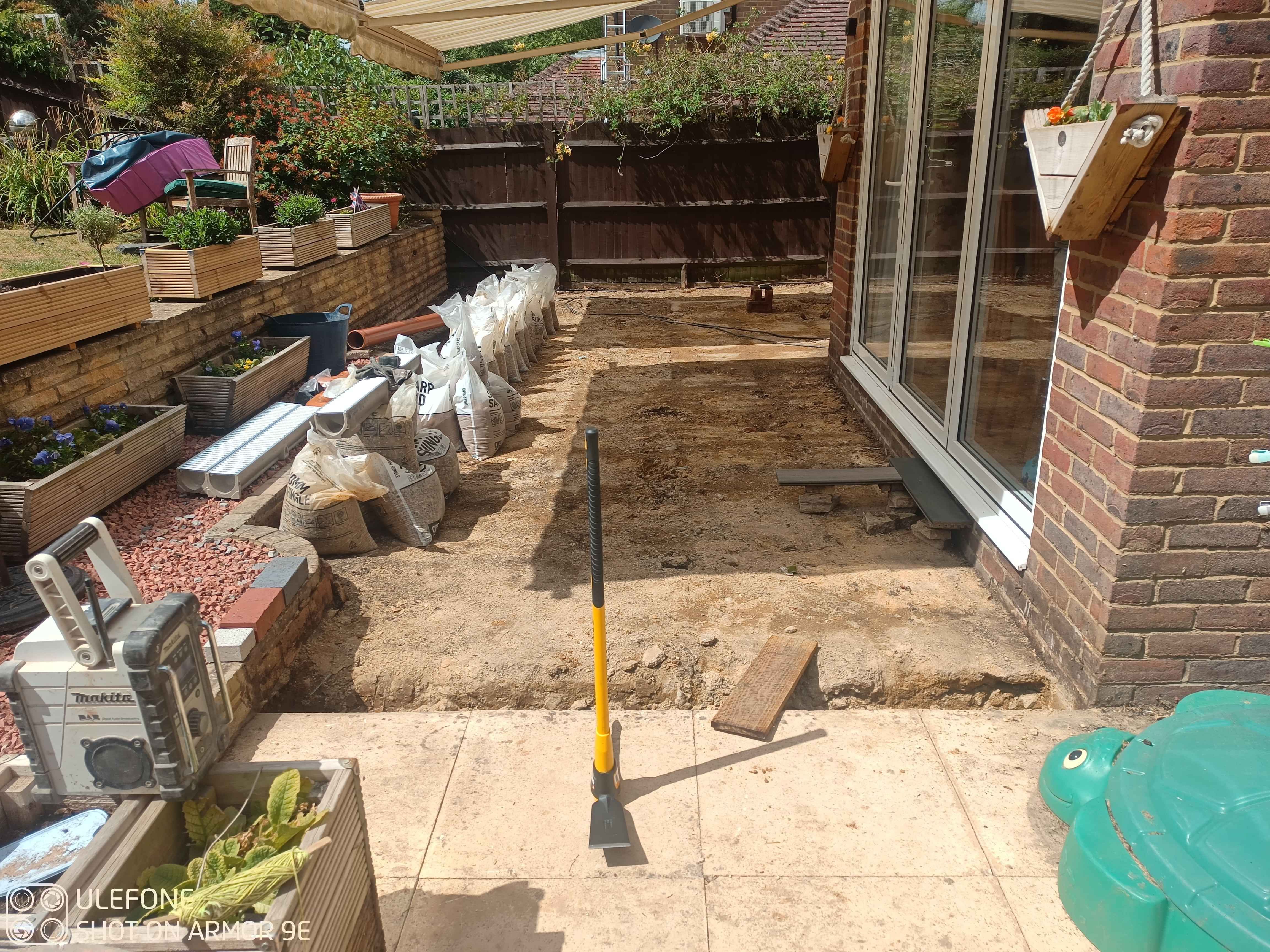 Excavating for the ACO drainage channel so the surface water from the adjacent patio will clear.