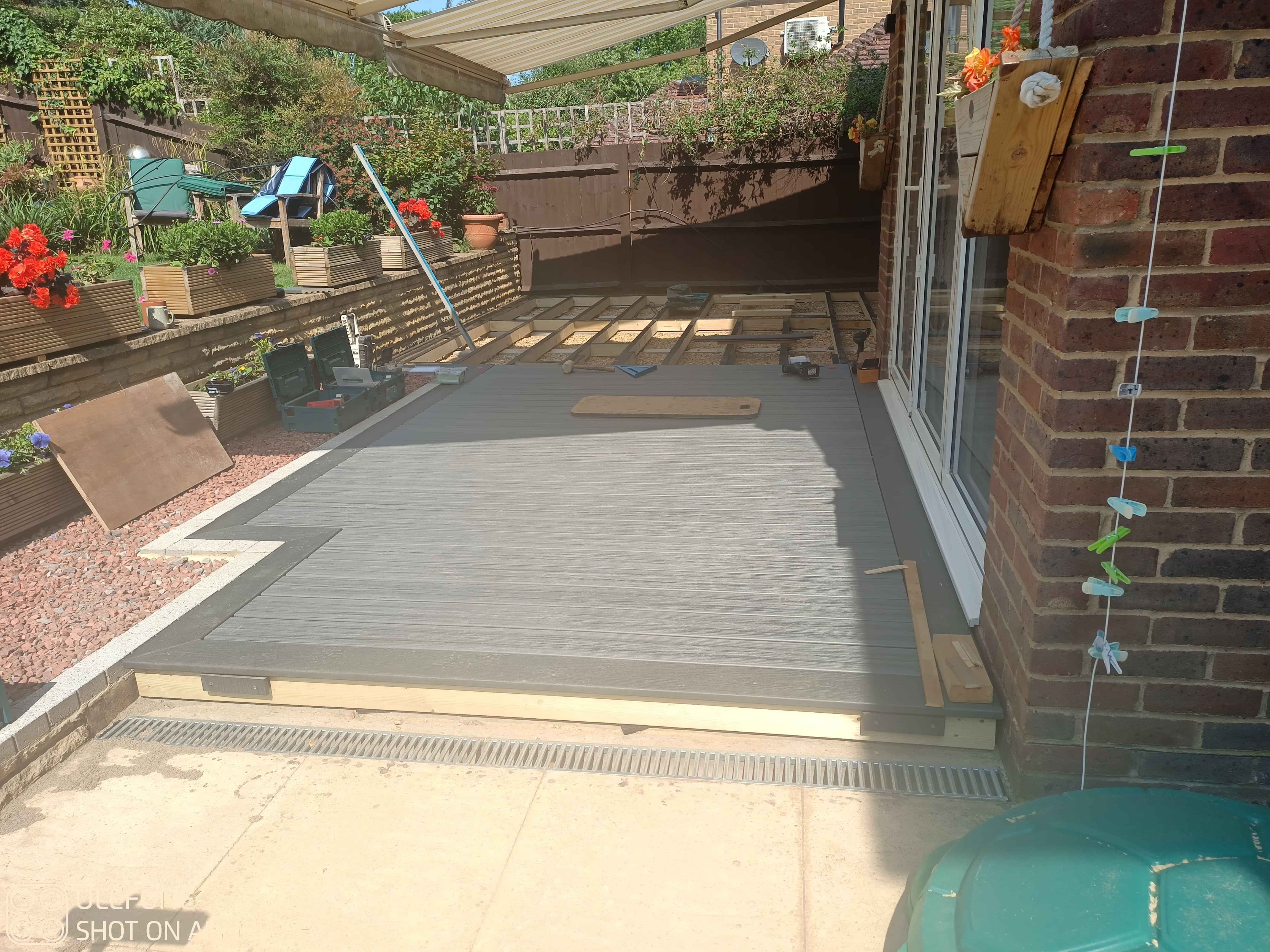 This image shows half the deck boards are now down and fitted, progress!