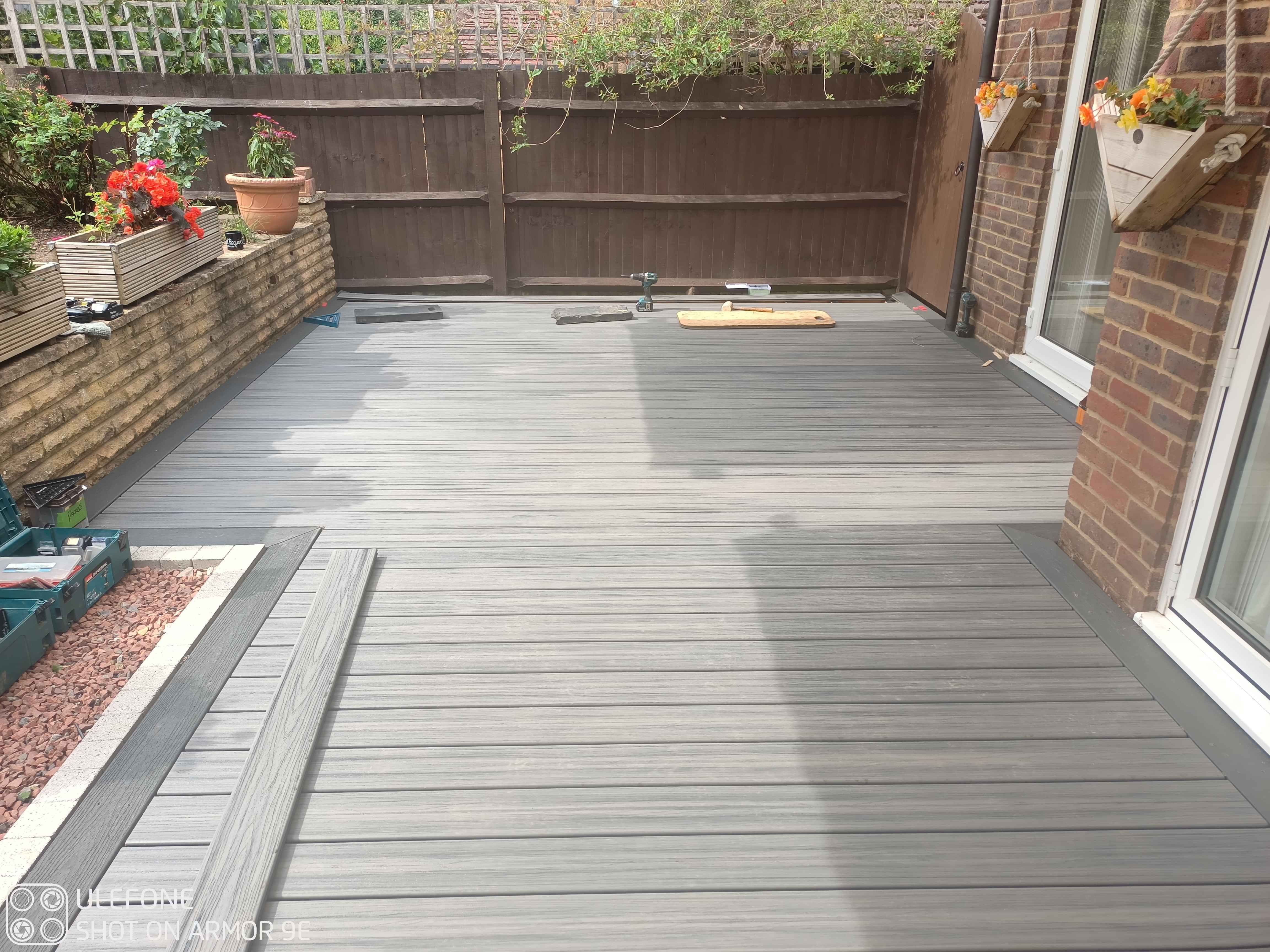 This image shows the last few deck boards to install close to the fence at the far end, nearly done now!