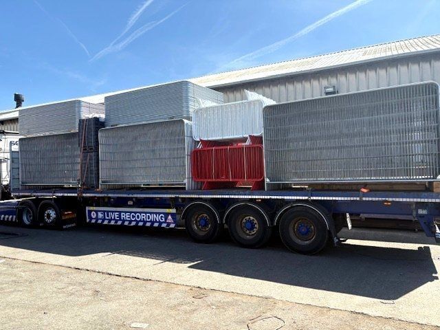 Galvanized Heras temporary fencing panels loaded onto a HGV for delivery in the North West