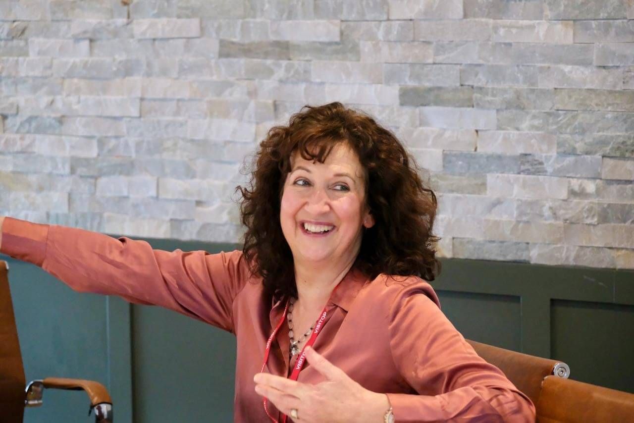 Jane smiling and gesturing